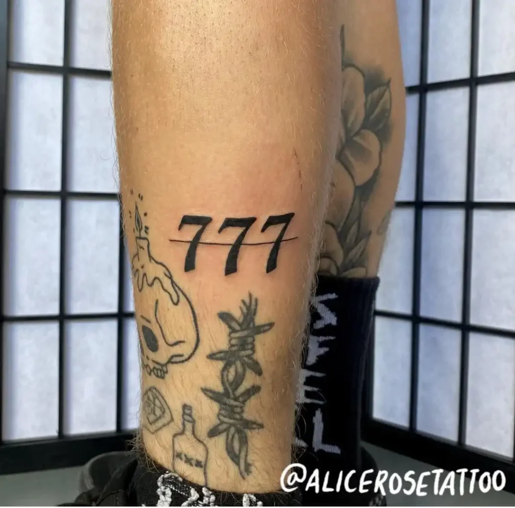 Small 777 tattoo